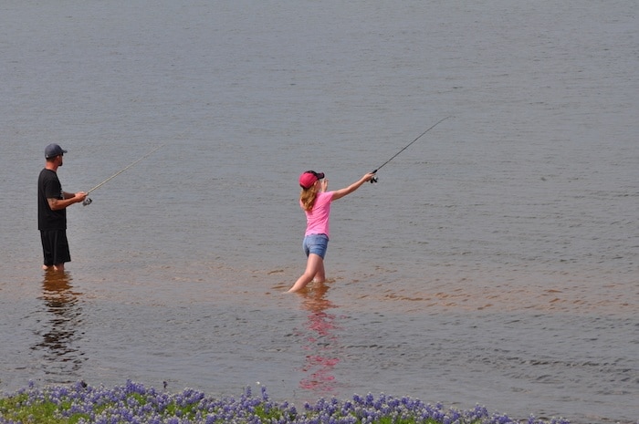 Image of guest fishing in the lake at our Texas cabin rentals in the heart of the Texas Hill Country. Best family friendly cabin rentals in Texas are here at Willow Point