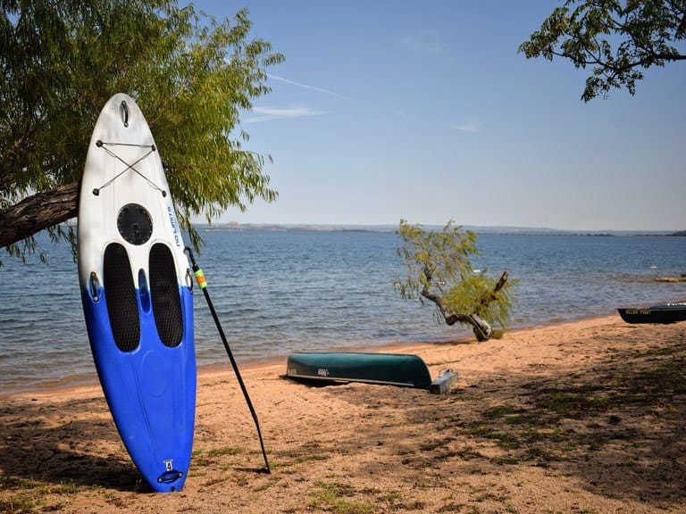 Image of standup paddle board and canoe rentals available daily for guests to use. These are the best lake activities in Texas out on Lake Buchanan