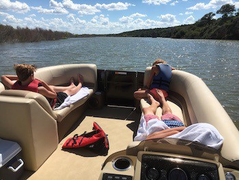 Image of guests enjoying scenic lake cruise tour on our pontoon boat rental at Willow Point Resort: one of the best Texas vacation spots