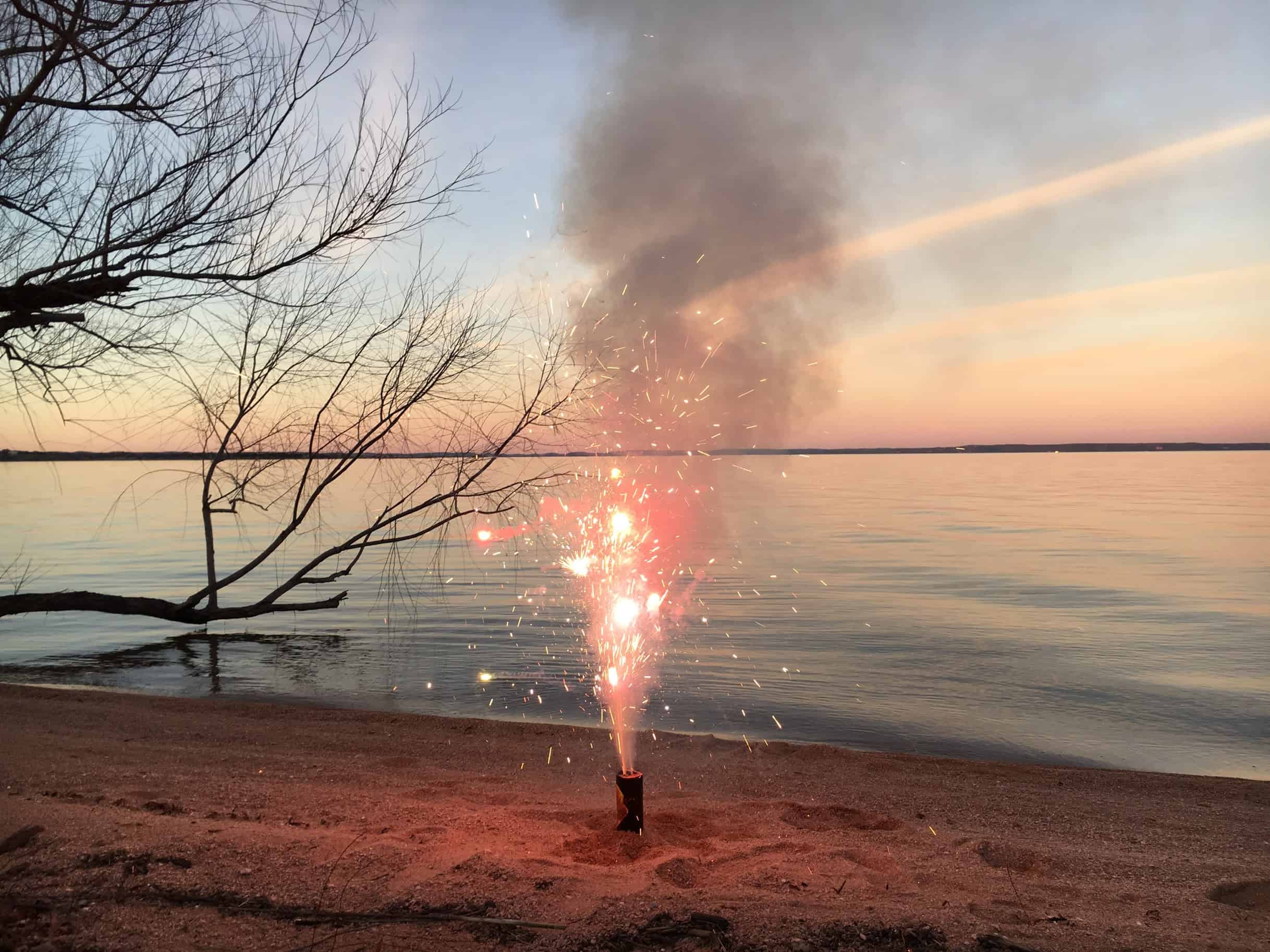 Image of fireworks at the lake. Best New Years Eve ideas for families