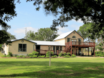 Image of the Lake House exterior. Located at one of the best family resorts in Texas, Willow Point Resort.