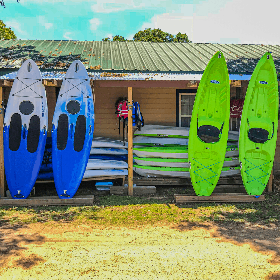 Image of standup paddle board and kayak rentals available daily for guests to use. These are the best lake activities in Texas out on Lake Buchanan
