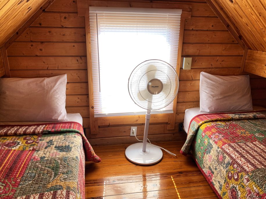 Image of two twin beds in the upstairs loft of our private Texas lake cabin rentals