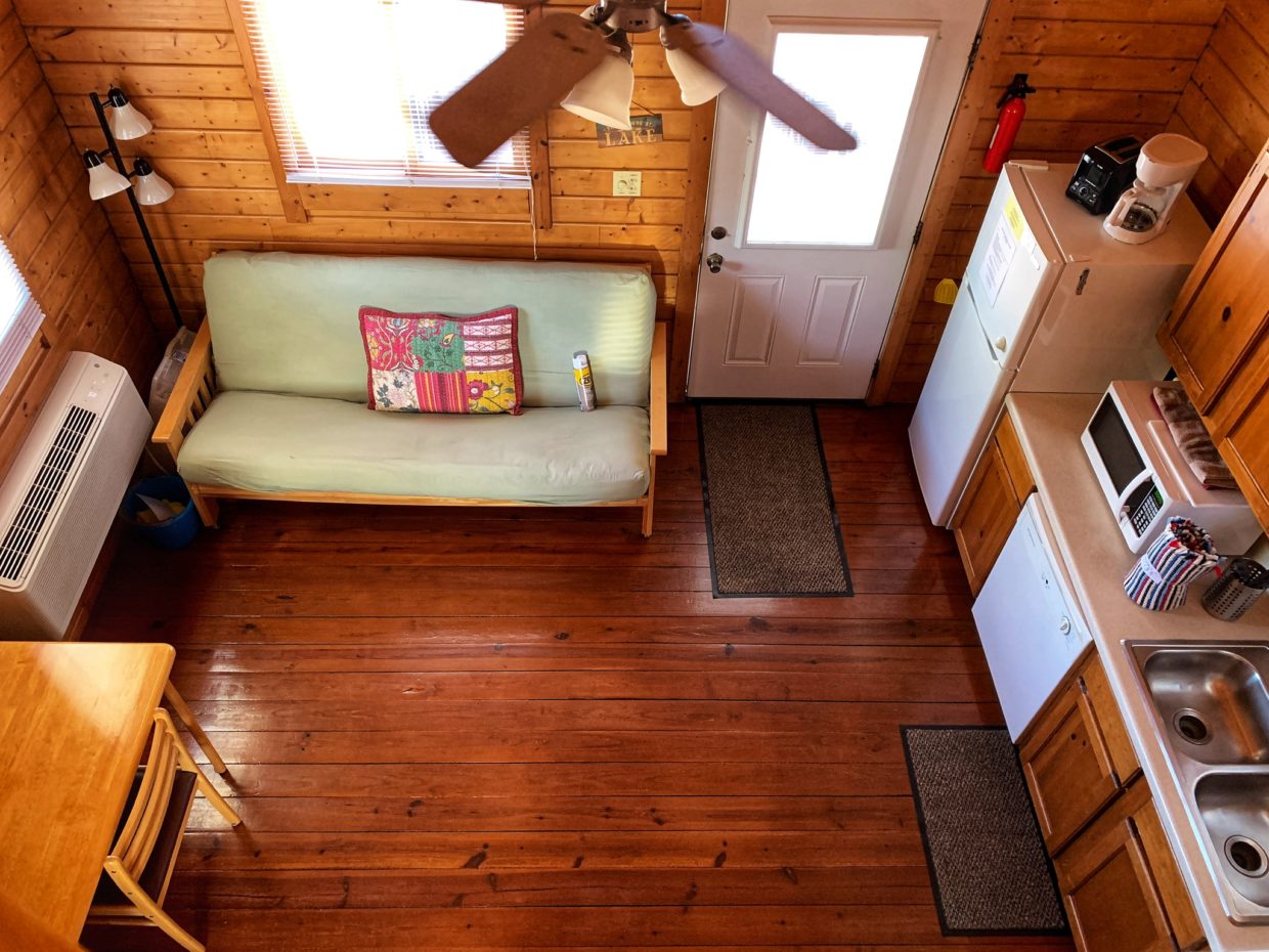 Image of living/dining area inside cabins taken from the upstairs loft